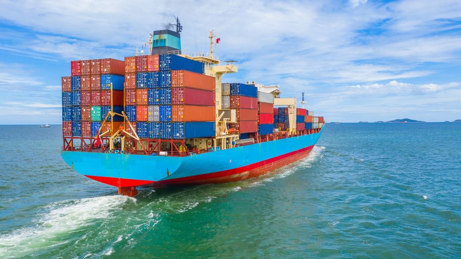 Container cargo ship leaving port